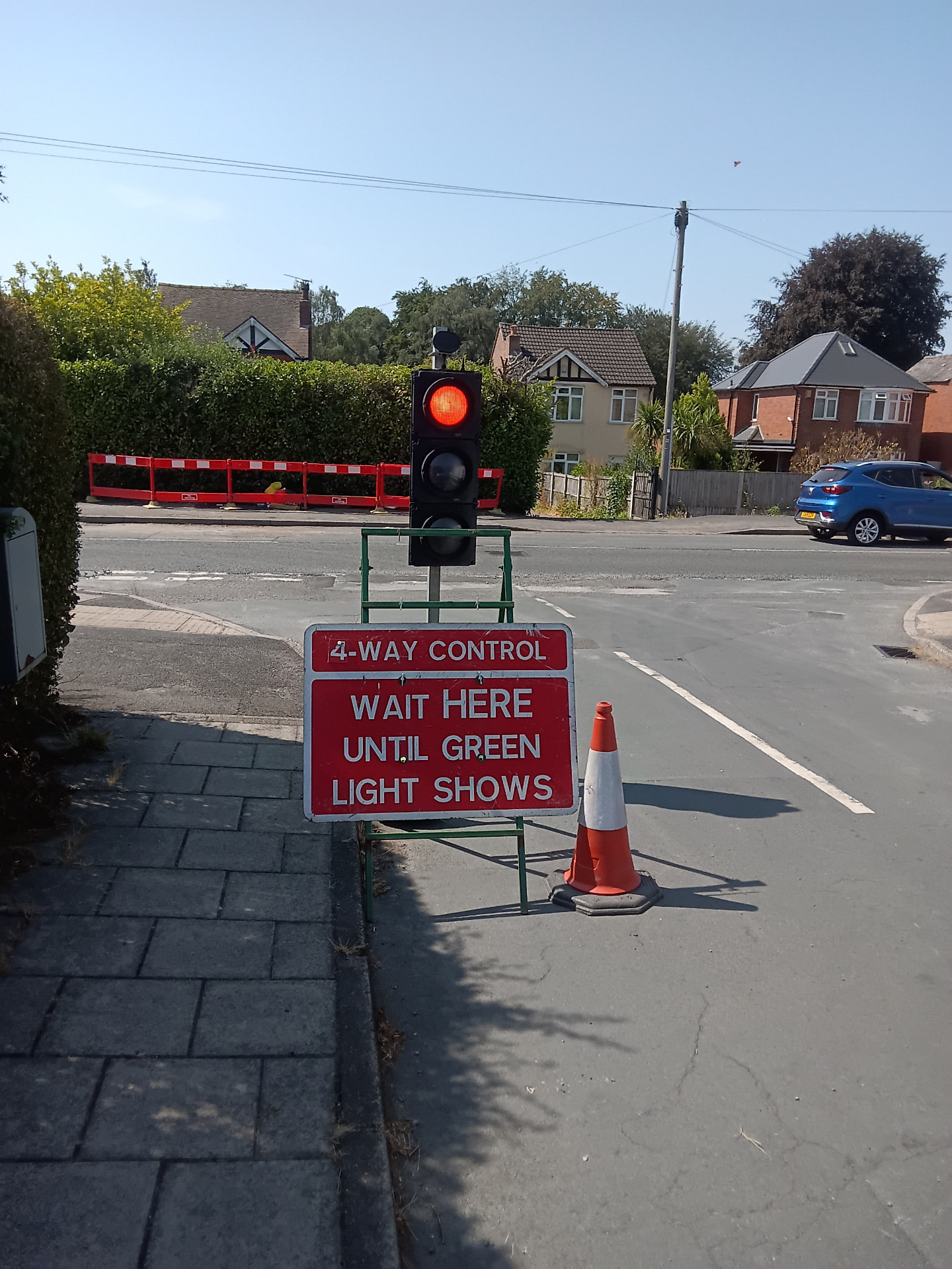 Four-way portable traffic signal control set up at a junction